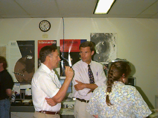 Instrument manager Ron Follas (left) discusses the instrument performance with Jim Abshire and Peggy Jester.