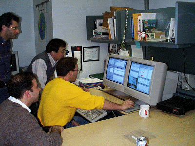 Rob Afzal, Xiaoli Sun, Greg Elman and Oded Aharonson check telemetry at the initial turn-on of MOLA during the MOC calibration period -- our first turn-on in the MGS 400-km circular orbit.